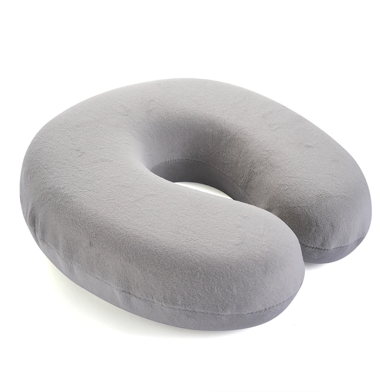 Ergonomic U-shaped memory foam pillow for optimal neck support during eyelash extensions and beauty treatments.